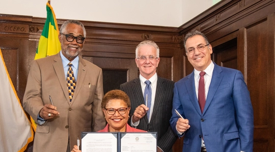 mayor Bass display sifged budget ordinance with Councilmembers Price, Krekorian and Blumenfield.