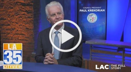 Council President Krekorian seated at table in television studio.