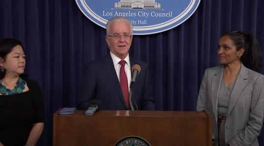 Council President Kreorian at lectern with Kathay Feng and Councilmember Nithya Raman.