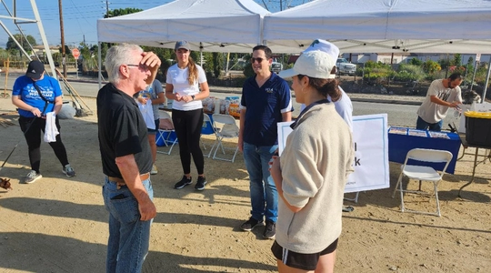 Council President Emeritus Krekorian speaks with the volunteers.