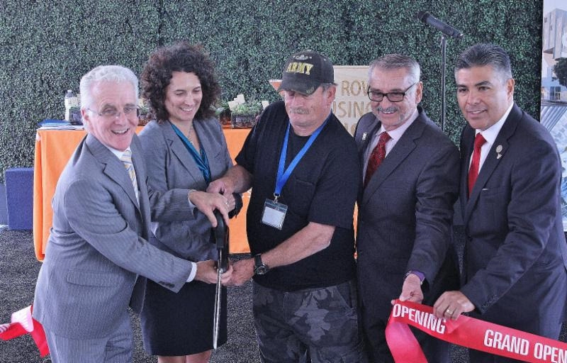 Council President cutting ribbon with veteran