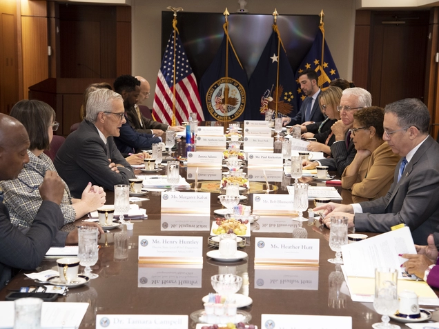 Councilmembers seated at long conference table with Veterans Affairs Secretary.