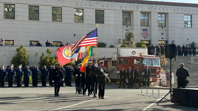 A picture of the LAFD marching with flags.