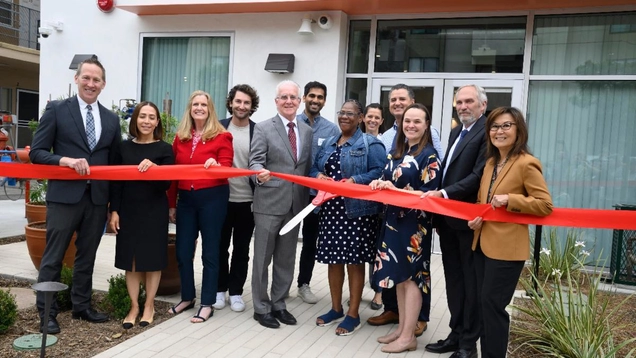 A photo of Council President Krekorian cutting the ribbon for NoHo 5050 Permanent Supportive Housing.