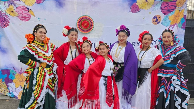 Latino Heritage Celebration dancers pose for the group photo.