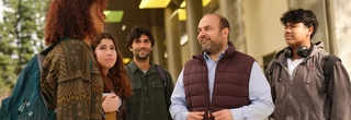 Councilmember Nazarian talking with students outdoors at L.A. Valley College campus.